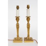 EDWARD F. CALDWELL & CO. NEW YORK: A PAIR OF AMERICAN GILT-METAL CANDLESTICK TABLE LAMPS (2)