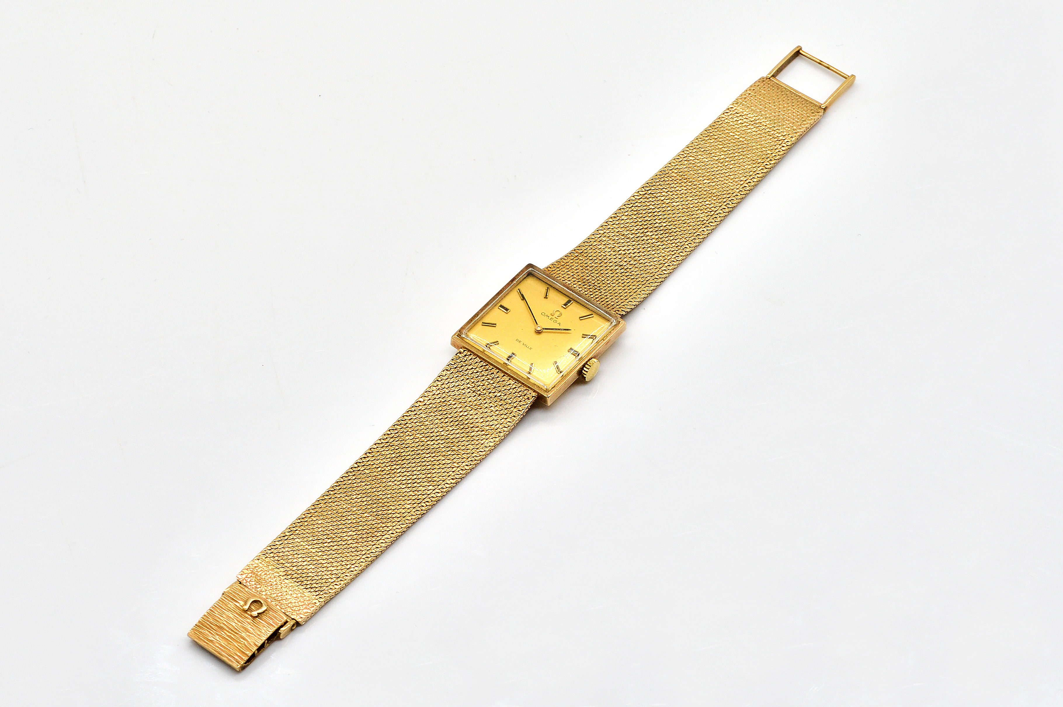 A 9CT GOLD OMEGA DE VILLE MANUAL WIND WRISTWATCH