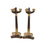 A PAIR OF FRENCH RESTAURATION PARCEL-GILT AND PATINATED BRONZE THREE-LIGHT CANDELABRA (2)