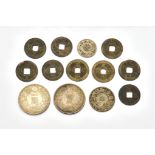 A GROUP OF JAPANESE COINS (13)