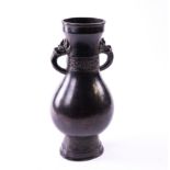 A CHINESE BRONZE VASE (HU)