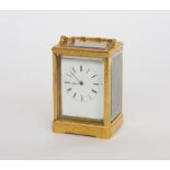 MARCHAND A GENEVE: A SWISS GILT BRASS CARRIAGE CLOCK