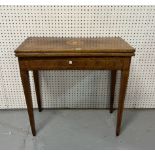 A 19TH CENTURY SATINWOOD RECTANGULAR FOLDOVER GAMES TABLE