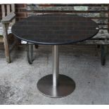 A MODERN CIRCULAR MARBLE TOPPED KITCHEN TABLE ON CHROME BASE