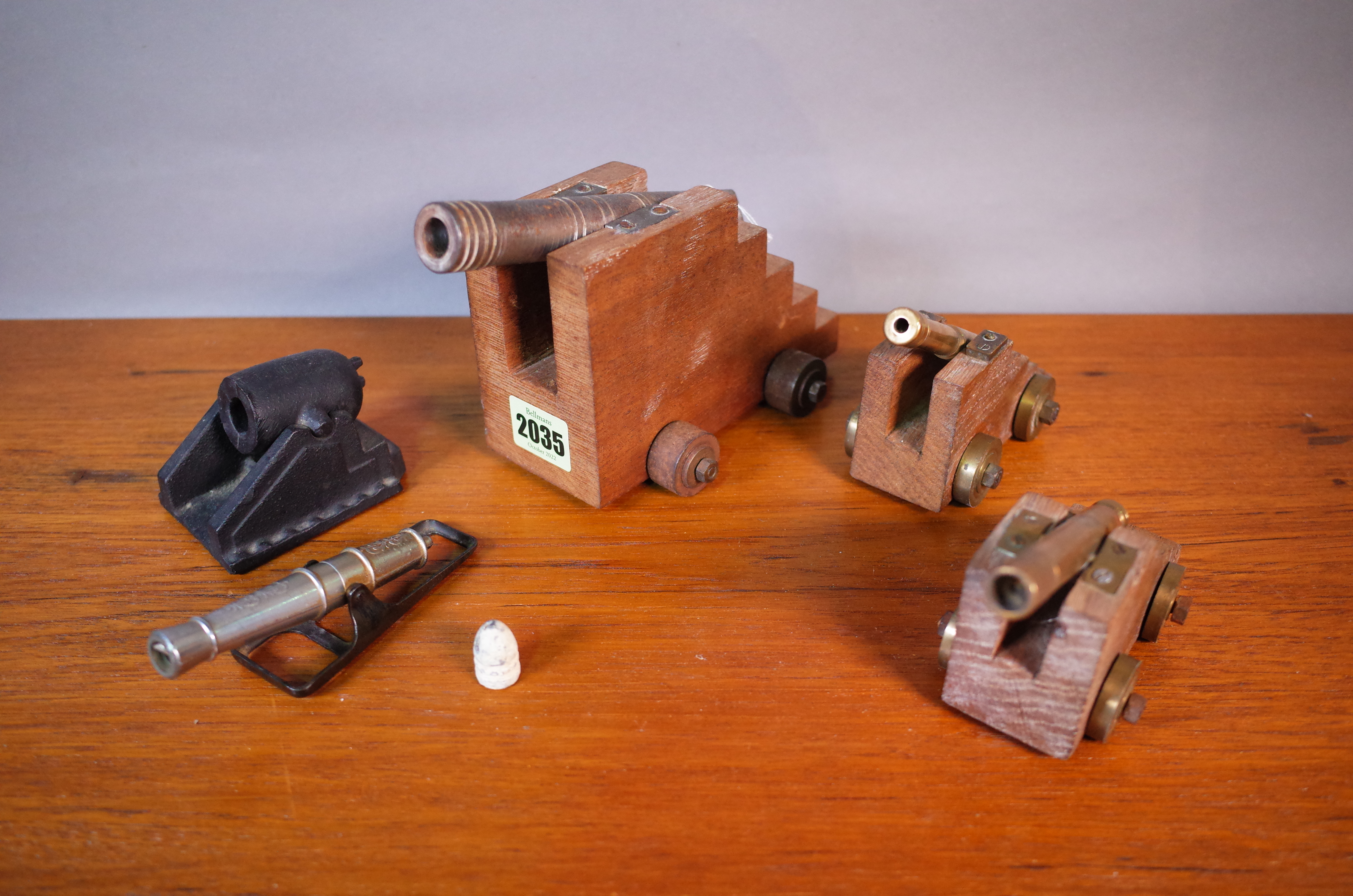 A GROUP OF FIVE MINIATURE MODELS OF CANNONS (5)