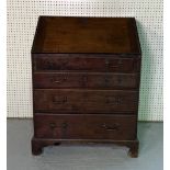 A GEORGE III OAK BUREAU