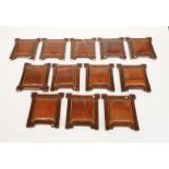 A SET OF TWELVE VICTORIAN OAK AND EBONISED FRAMED LEATHER CHAIR BACKS (12)