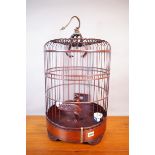 A MODERN ASIAN HARDWOOD HANGING BIRDCAGE