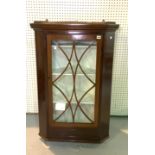 A 19TH CENTURY MAHOGANY GLAZED CORNER CABINET