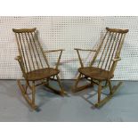 ERCOL; A PAIR OF MODERN ASH AND ELM ROCKING ARMCHAIRS (2)