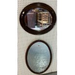 A MAHOGANY OVAL WALL MIRROR (2)