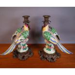 A PAIR OF CERAMIC AND GILT METAL MOUNTED MODELS OF PARROTS, 29CM TALL (2)