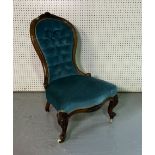 A VICTORIAN WALNUT FRAMED SPOONBACK NURSING CHAIR