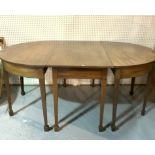 A GEORGE III MAHOGANY TRIPLE SECTION EXTENDING DINING TABLE