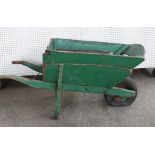 AN EARLY 20TH CENTURY GREEN PAINTED WHEEL BARROW