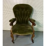 A VICTORIAN CARVED WALNUT FRAMED SPOONBACK OPEN ARMCHAIR