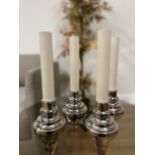 FOUR SILVERED METAL LAMP BASES WITH ELECTRIC CANDLE FITTINGS (4)
