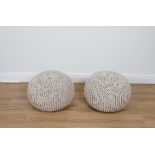 A PAIR OF COTTON UPHOLSTERED POUFFES (2)