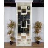 A WHITE PAINTED OPEN BOOKCASE