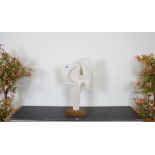 A FAUX MARBLE ABSTRACT SCULPTURE ON STAND