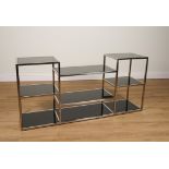 A CHROME AND BLACK GLASS MULTI TIER SIDE UNIT