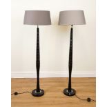 A PAIR OF BLACK PAINTED RIBBED STANDARD LAMPS (2)