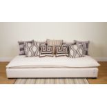 CUSHIONS, A GROUP OF NINE ASSORTED CUSHIONS IN BROWN AND WHITE (9)