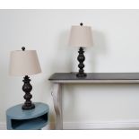 LIGHTING, A PAIR OF FAUX WOODEN TABLE LAMPS WITH TAPERING COTTON SHADES (2)