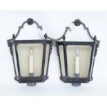 A PAIR OF BLACK TOLE-PEINTE WALL LANTERNS (2)