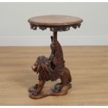 A 19TH CENTURY ITALIAN CARVED WALNUT OCCASIONAL TABLE ON WINGED LION SUPPORT