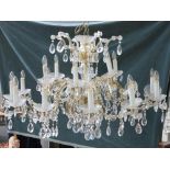 PROBABLY SWAROVSKI: A LARGE CUT GLASS EIGHTEEN BRANCH CHANDELIER