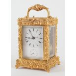 A RARE AND UNUSUAL GILT CAST-BRASS CARRIAGE CLOCK WITH PUSH REPEAT AND ALARM FOR THE CHINESE...