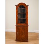 AN EARLY 18TH CENTURY FEATHER-BANDED WALNUT BONNET TOP FLOOR STANDING CORNER DISPLAY CABINET...