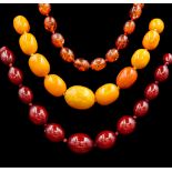 A SINGLE ROW OF AMBER BEADS AND TWO FURTHER BEAD NECKLACES (3)