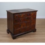 A GEORGE II WALNUT CHEST OF DRAWERS