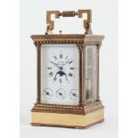 A FRENCH BRASS CARRIAGE CLOCK WITH PUSH REPEAT, ALARM, MOONPHASE AND CALENDAR