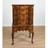 A QUEEN ANNE STYLE WALNUT SHAPED FOUR DRAWER CHEST ON STAND