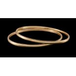 TWO PLAIN OVAL BANGLES IN 9 CT GOLD