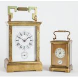 A FRENCH BRASS CARRIAGE ALARM CLOCK AND A SMALLER CARRIAGE ALARM TIMEPIECE (2)