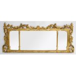 A 19TH CENTURY CARVED GILTWOOD TRIPLE PLATE OVERMANTEL MIRROR