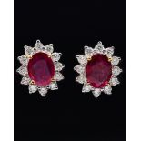 A PAIR OF RUBY AND DIAMOND CLUSTER EARRINGS