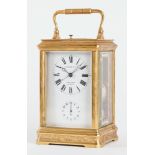 AN ENGRAVED GILT-BRASS CARRIAGE CLOCK WITH PUSH REPEAT AND ALARM FOR THE CHINESE MARKET