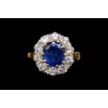 A SAPPHIRE AND DIAMOND OVAL CLUSTER RING