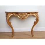 AN 18TH CENTURY STYLE SERPENTINE SHAPED MARBLE MOUNTED GILT CONSOLE TABLE