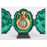 AN UNUSUAL VICTORIAN GILT-BRASS TURQUOISE AND PASTE SET STRUT TIMEPIECE IN THE FORM OF A TWIN...