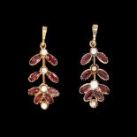 A PAIR OF GOLD, GARNET AND SEED PEARL PENDANTS (2)