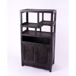 AN EARLY 20TH CENTURY CHINESE-EXPORT CARVED HARDWOOD TABLE CABINET