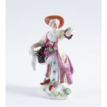 A DERBY FIGURE OF A WOMAN SELLING FRUIT