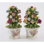 A PAIR OF BOW TUBS OF FLOWERS (2)