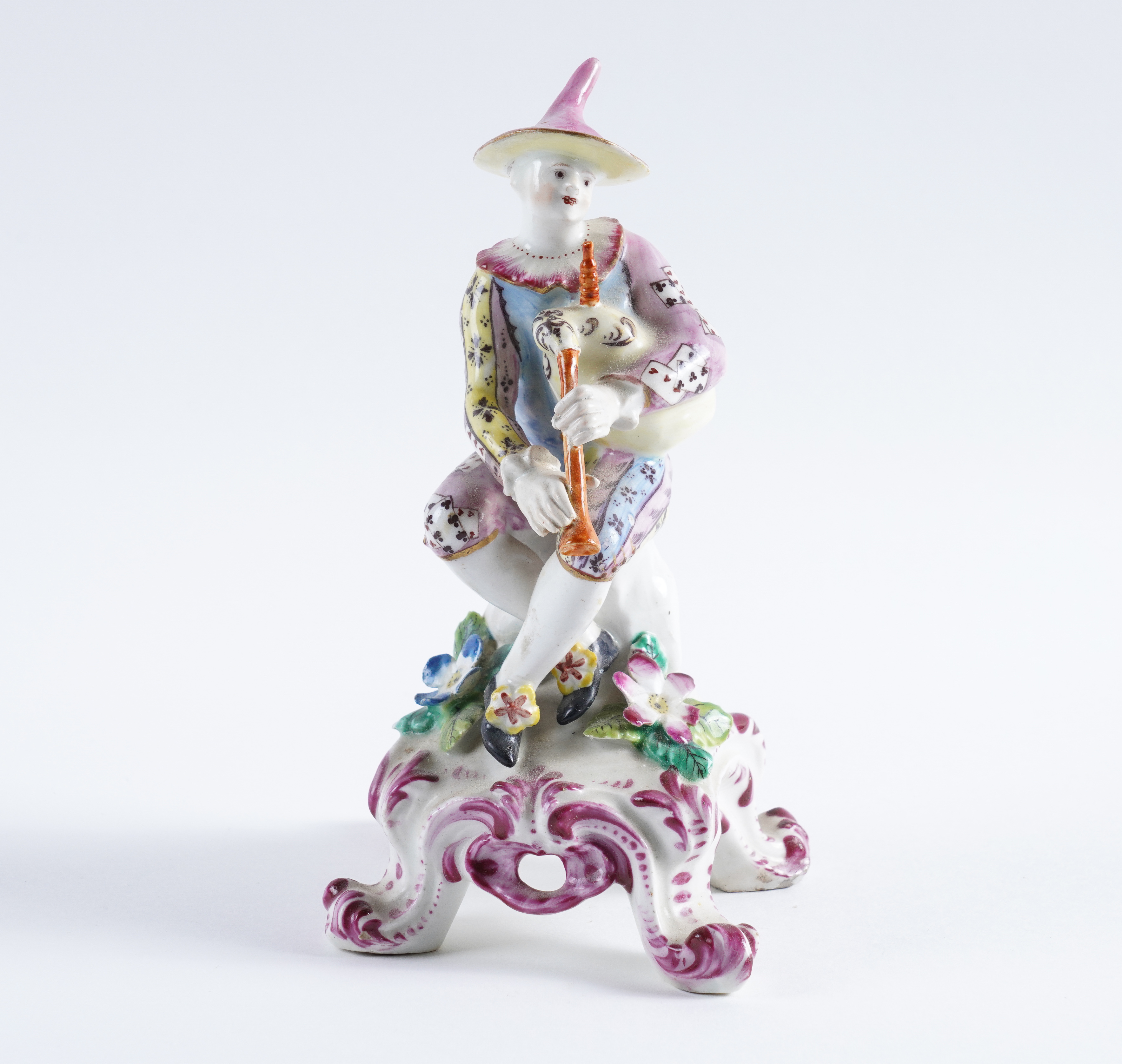 A BOW FIGURE OF HARLEQUIN